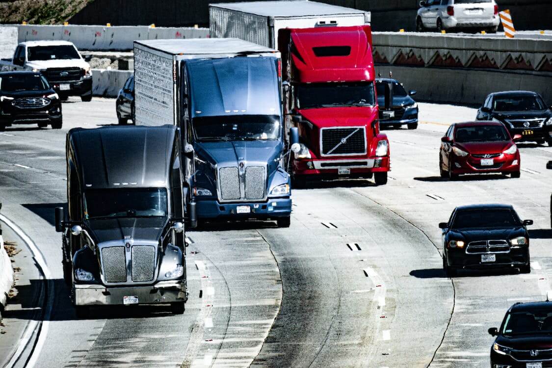https://dev.firstfrontier.ca/storage/2023/07/free-photo-of-trucks-and-cars-on-a-highway.jpeg